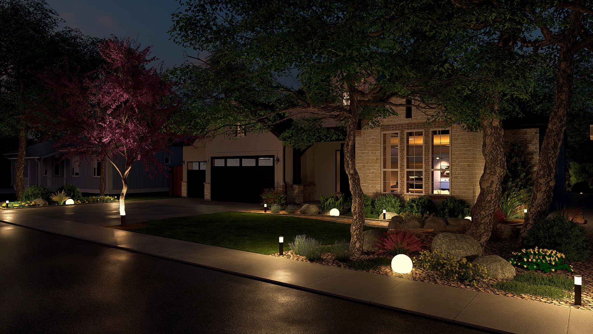 Front yard at night with illuminated landscape