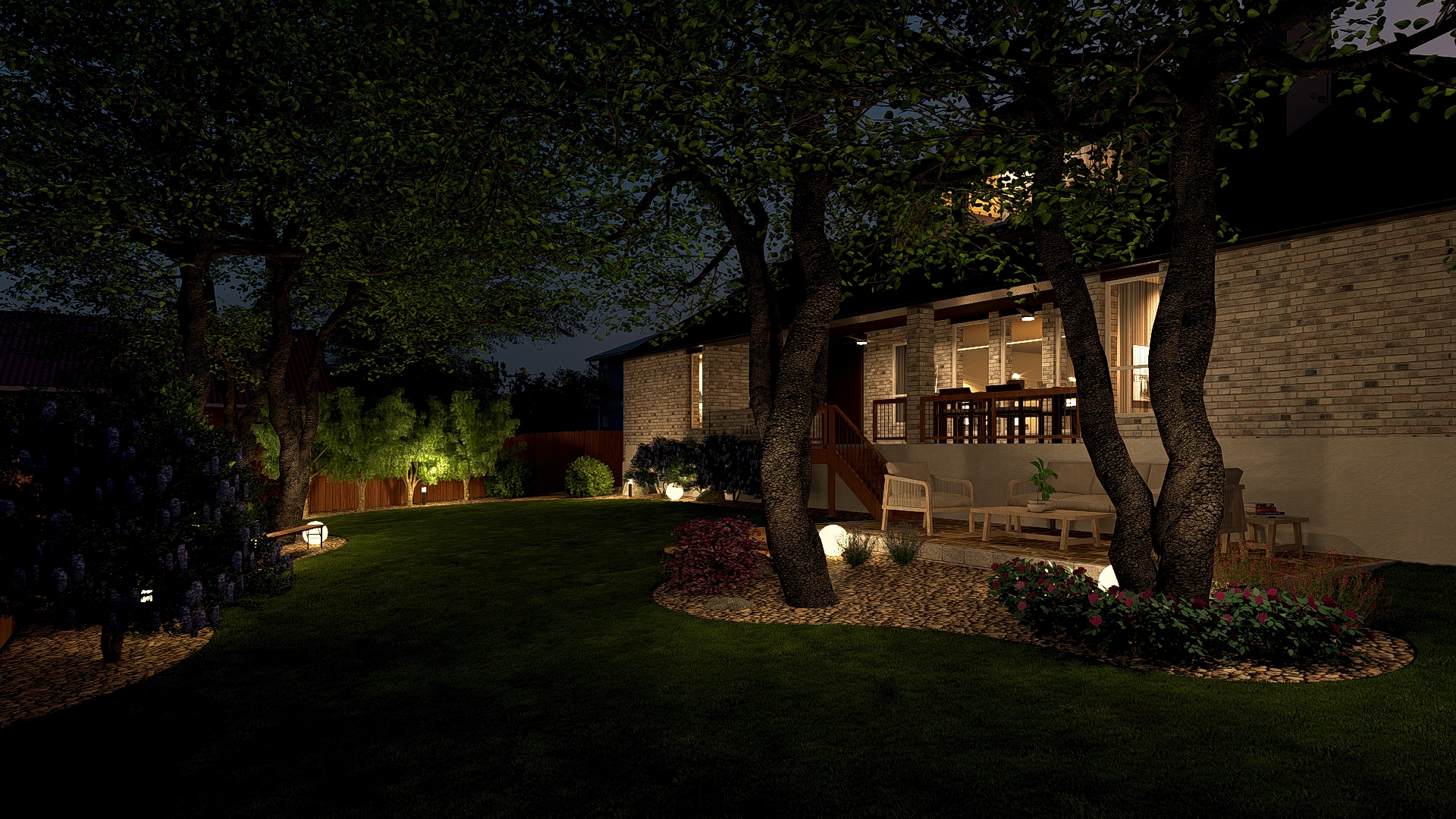 Night view of backyard with illuminated deck and seating beneath oaks